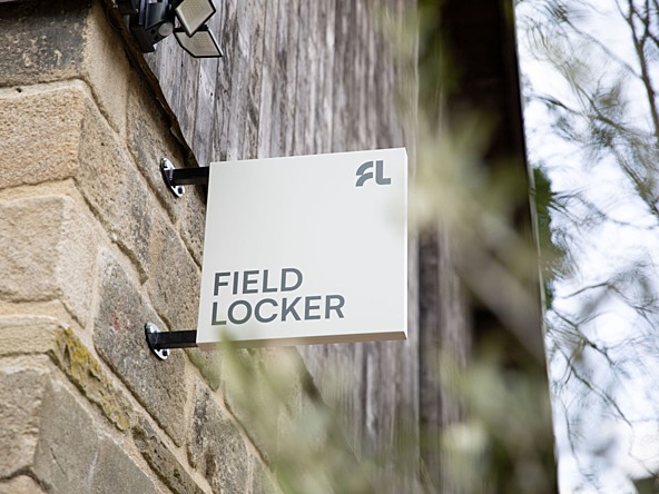 Field Locker's new premises. Image shows a sign attached to the side of an historic building reading 'Field Locker'